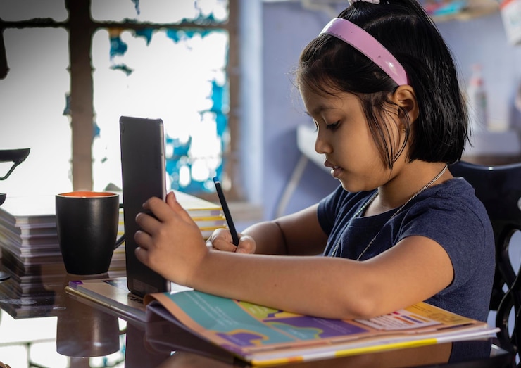 indian-cute-girl-child-studying-home-with-tablet_1048944-16606711