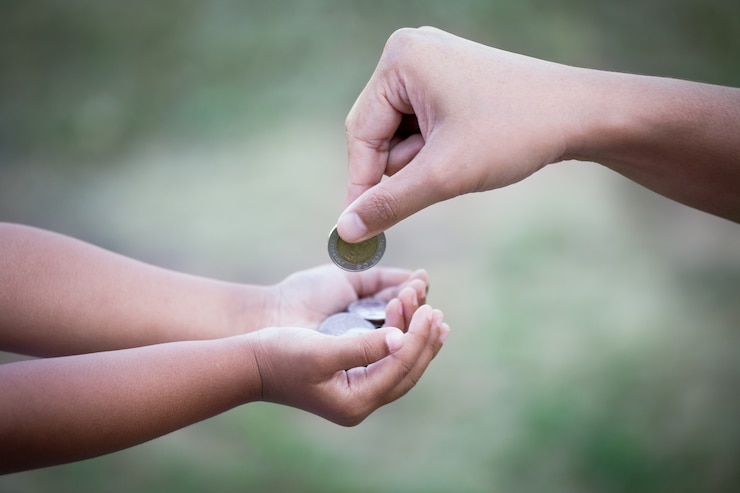 mother-giving-coin-child-as-saving-money-concept-vintage-color-tone_7186-277